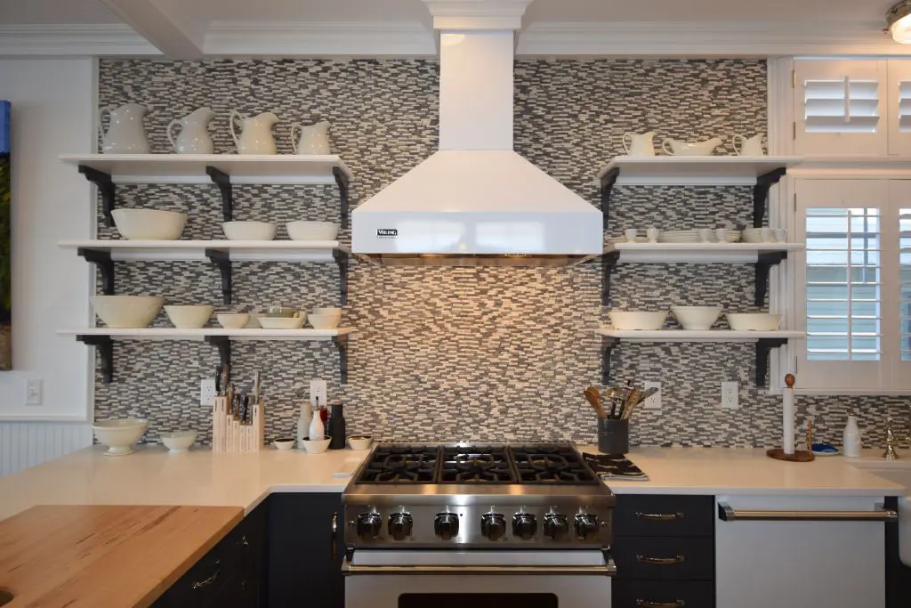 67b5158241ce2_19-W-Cumberland-HC-Kitchen-Range-Hood A kitchen with shelves and a stove in it
