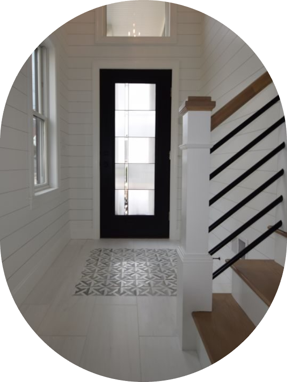 GettyImages-176816406 A door way with a window and stairs leading to the top floor.